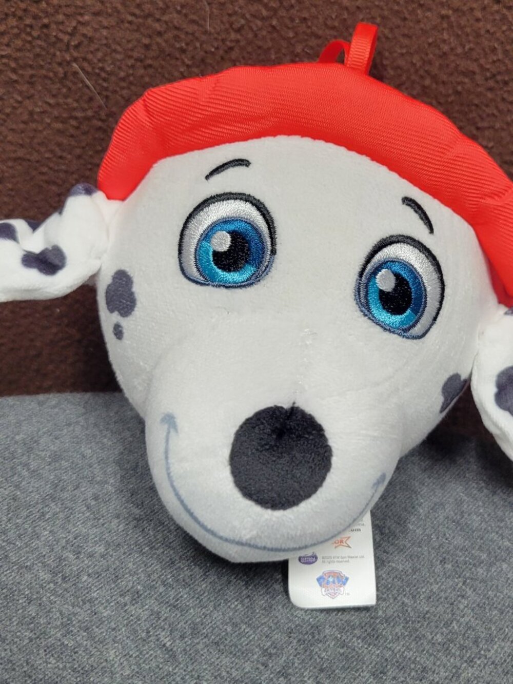 Those is a plush toy head of Marshall the Dalmation-
